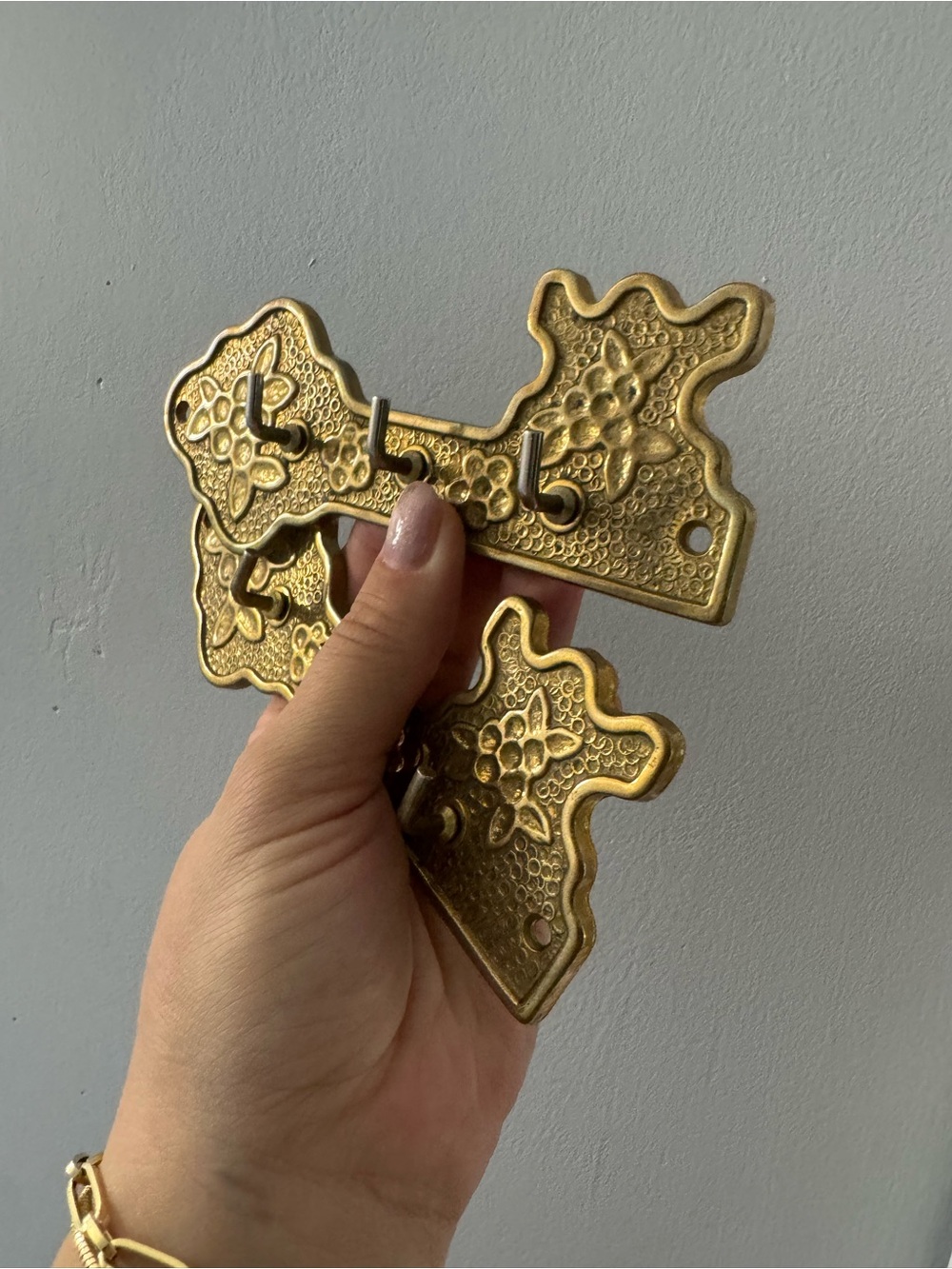 A pair of ornate brass French baroque style key hanger plaques